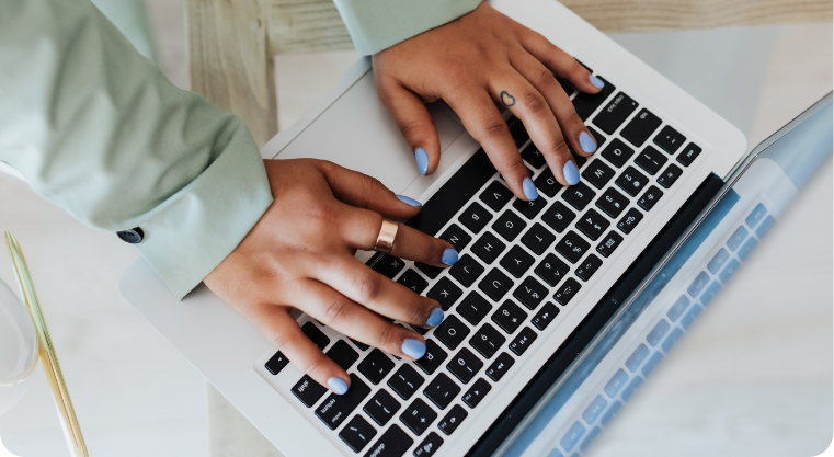 Person typing on laptop